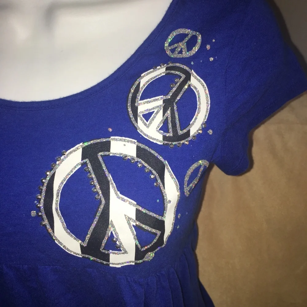 EUC Justice girls Sz 14 peplum style short sleeve top peace.